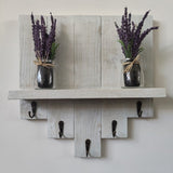 white floating shelf with hooks, key holder, coat rack